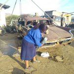 Nosipho-Kholutsoane,-Lereku-Trading-Classic-Cars,-working-on-a-1960-De-Soto