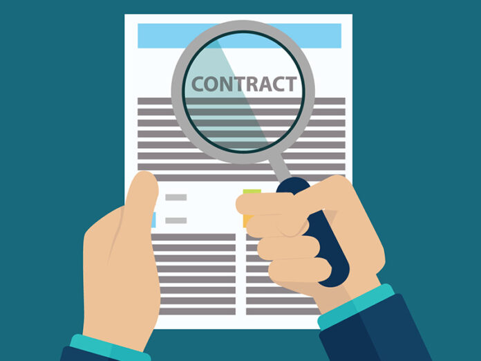 Small print in contracts magnifying glass
